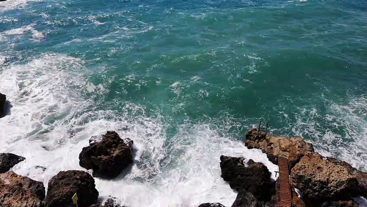 Rocksview-of-a-beautiful-beach-full-of-rocks natural beautiful royalty Free Stock no copyright video Free for commercial use dron dron aerial view (2)