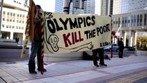 Olympics boss confronts Tokyo protesters