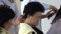 North Koreans rush to buy cosmetics and get hair styled on Mother's Day
