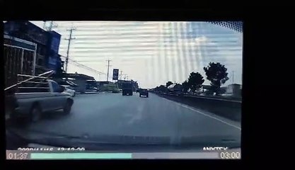Truck Crossing Lanes with Fence Sticking Out of Truck Bed