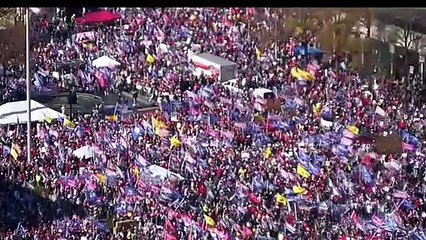 Trump supporters rush to see the president's motorcade driving by