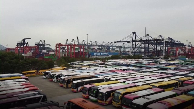 Tour bus ‘cemetery’ fills up in Hong Kong as coronavirus pandemic buries travel industry