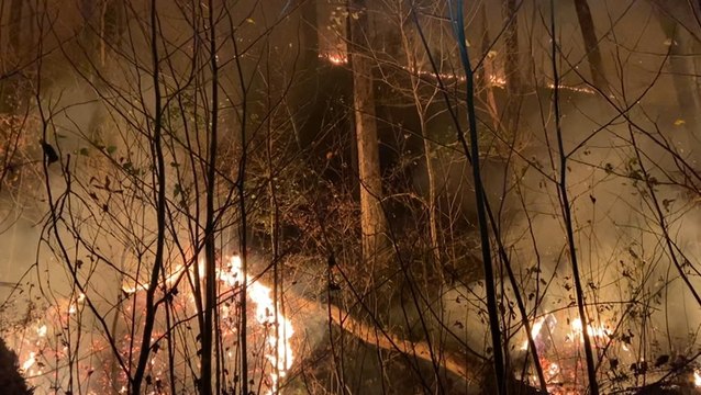 Tennessee fire crews perform back burning to contain fire