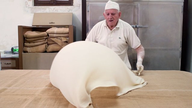 WATCH: An 86-year-old is one of the last Greek bakers who makes phyllo dough by hand. He turned his kitchen into a tourist attraction.