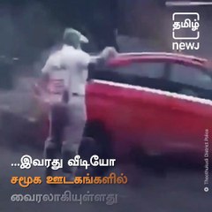 Traffic Cop Continues His Duty Even In The Storming Weather