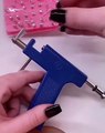 Girl Attempts To Pierce Her Ears With Piercing Gun