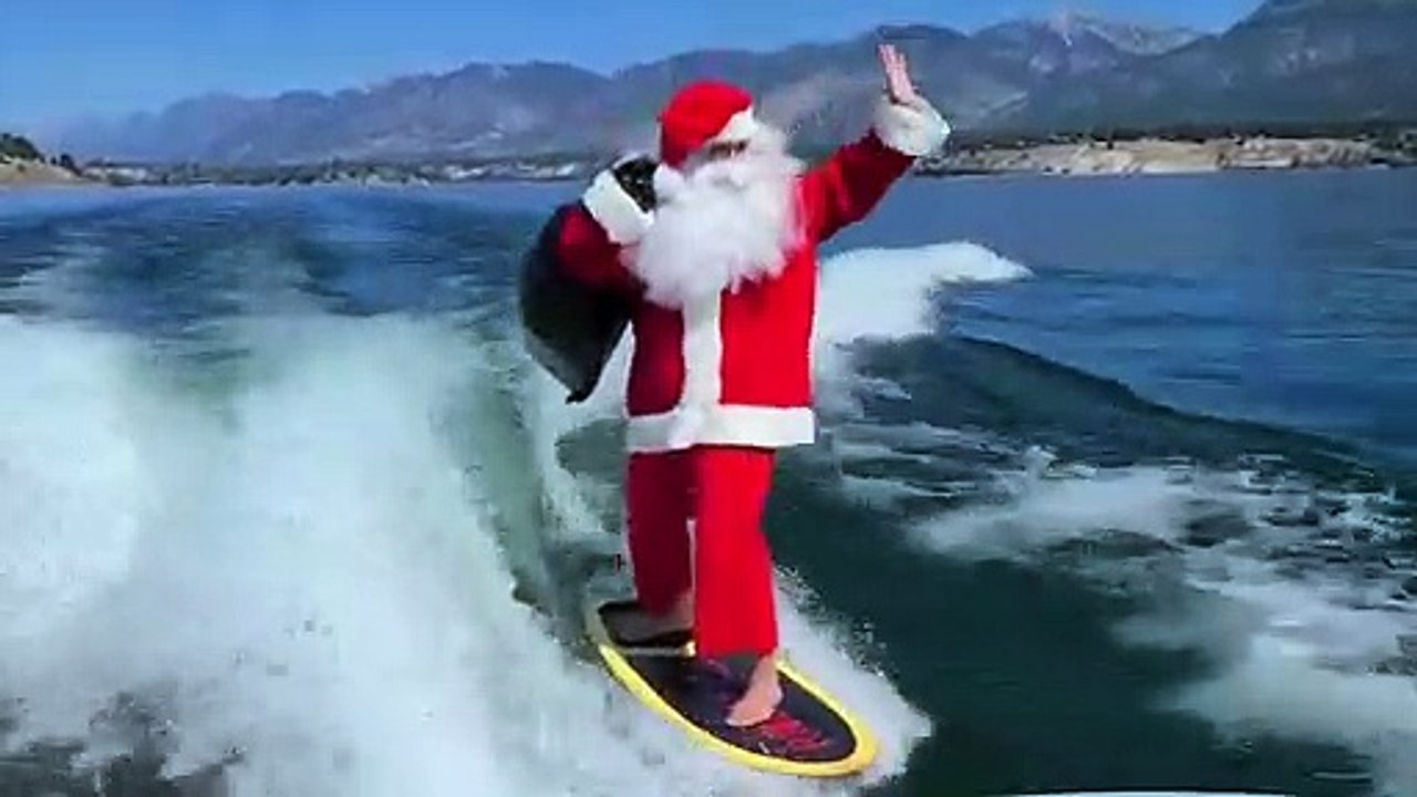 Woman Goes Surfing in Santa Costume