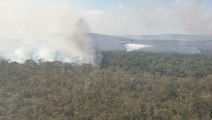 Crews battle bush fire from the sky in Queensland