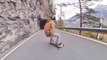 Skateboarder Skates on Sinuous Mountain Road