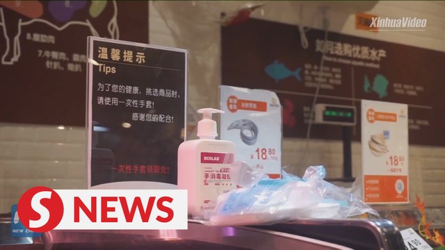 Covid-19: Shanghai supermarkets disinfect cold-chain products