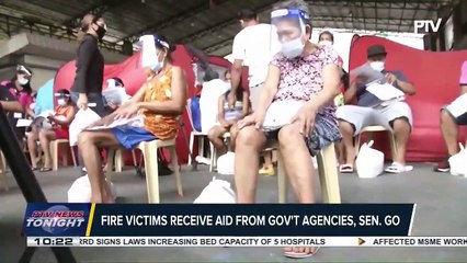 #PTVNewsTonight | Fire victims receive aid from gov't agencies, Sen. Go