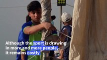 Sailing Baghdad's river bends, young Iraqis rock the boat