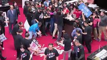 Brawl erupts in Taiwan's parliament as pig guts thrown by main opposition in protest at easing restrictions on US pork imports