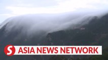 Stunning cloud waterfall cascades down China's Lushan Mountain