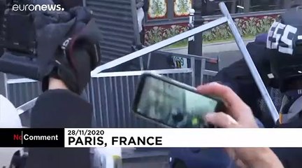 Scuffles, flares and tear gas at protest over French security bill