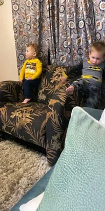Boy Slides off Side of Chair