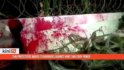 Thai protesters march to barracks against king's military power