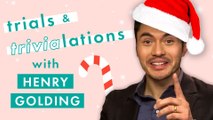 Henry Golding answers Christmas trivia in a game of Trials and Trivia-lations