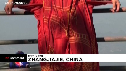 Asia's top wingsuit athlete jumps into the void from Tianmen Mountain