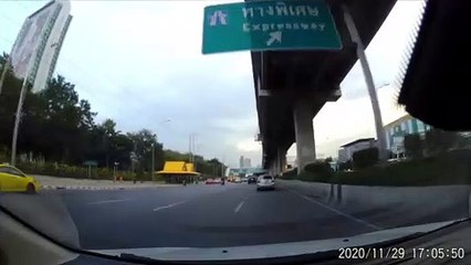 Vehicle Swerves into Car and Forces it onto Barricade