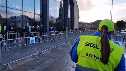 Members of the public queue at Johnstone Town Hall for asymptomatic coronavirus testing