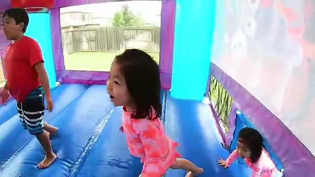 Ryan play with Inflatable Water Slide wit family