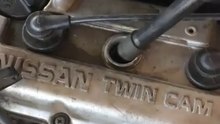 Testing for a weak or dead spark plug.