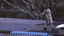 Man Practices His Martial Arts Skills on Rooftop