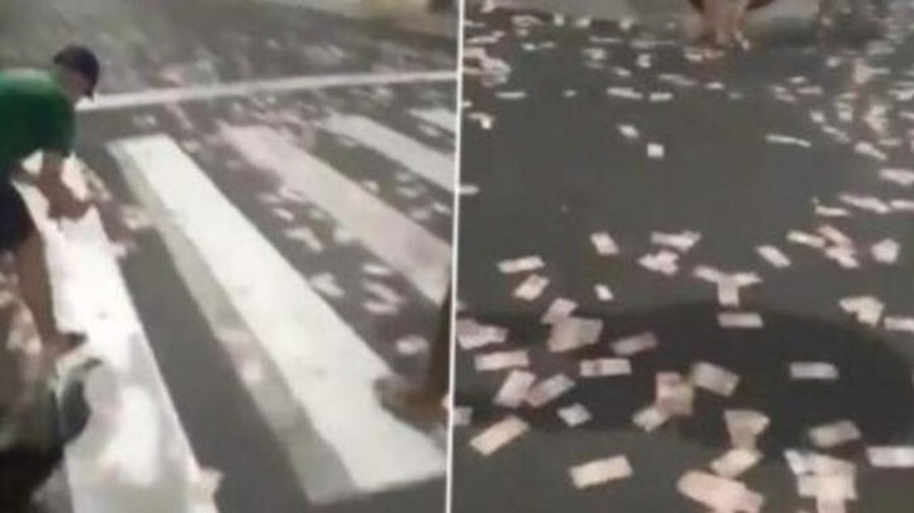 Brazil: Residents rush to collect cash after bank robbers scatter it on road