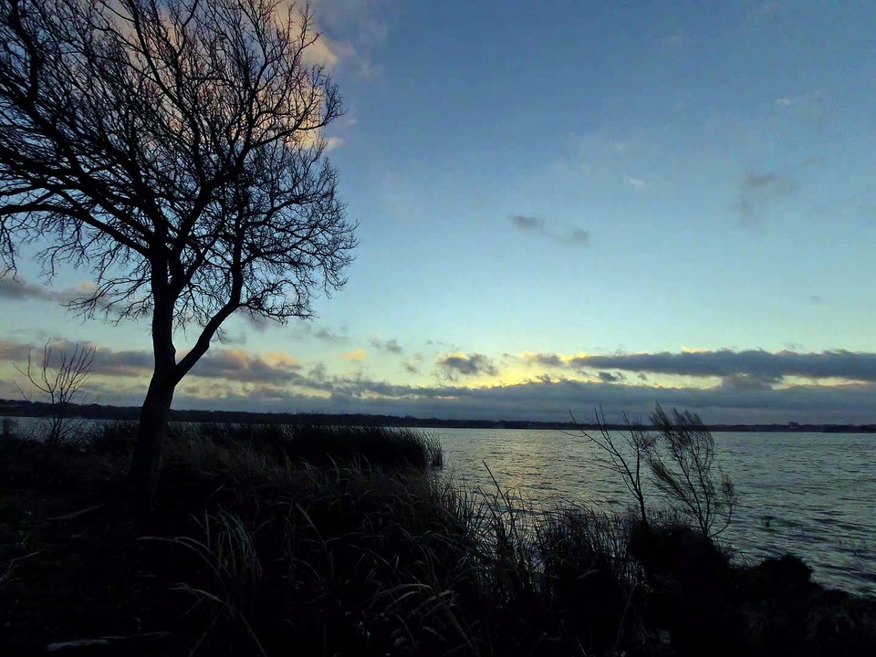Breaking Sunrise Over a Lake