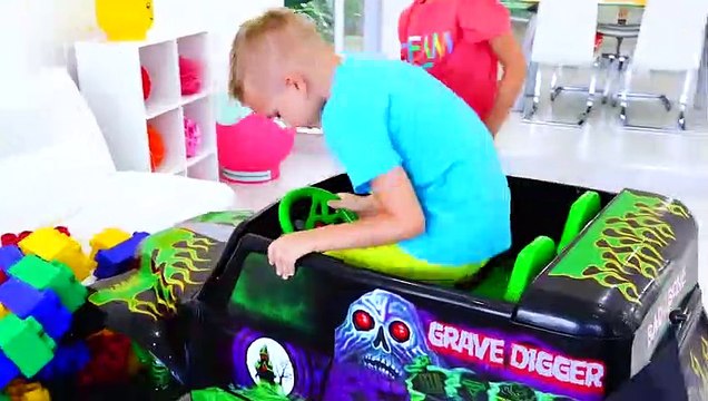 Vlad and Nikita ride on toy monster truck and goes through the cars for kids