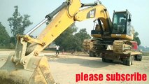 Azamgarh  JCB machine excavator unloading trailer