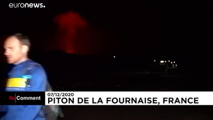 Locals gather to watch volcano erupt on French island of Reunion
