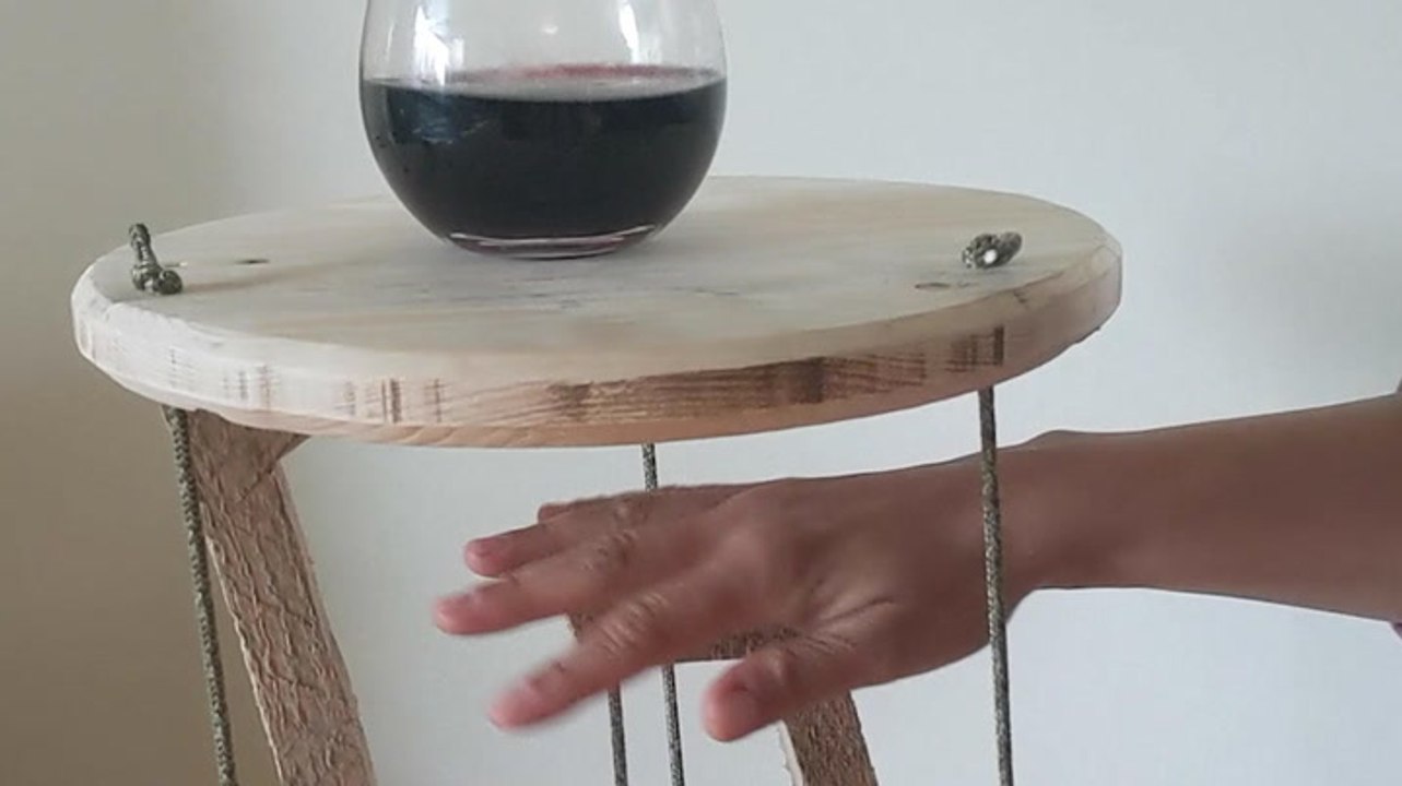 This floating side table is held up only by string