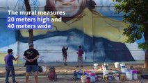 Street artist unveils mural to 'Saint' Diego Maradona