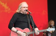 Sir Barry Gibb reveals home intrusion problems: 'People were climbing over the walls'