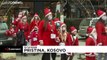 Santas gather in Pristina's main square to raise money for those hit by coronavirus pandemic