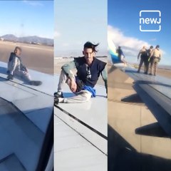 Watch: Man Climbs Onto Airplane Wing