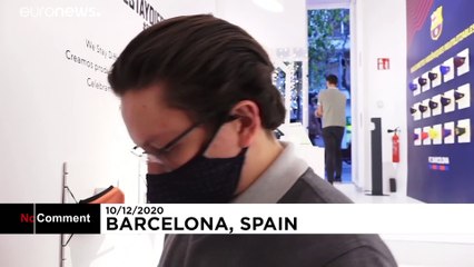 Shoppers in Spain buy face masks as holiday gifts