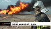 Iraqi firefighters extinguish fire at oil field suspected to have been caused by IS group