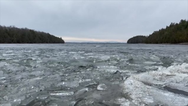 Ice-packed waves lap against the cold shores