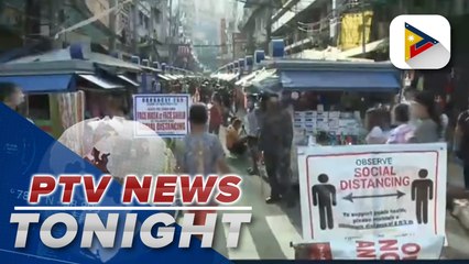 Barangay officials, SAF operatives guard entrance to popular retail center in Ilaya