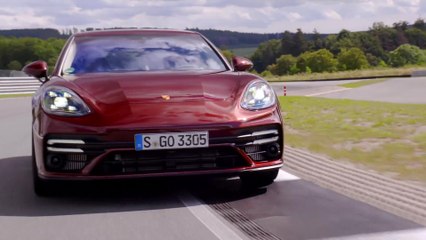 The new Porsche Panamera Turbo S in Cherry Metallic Track Driving