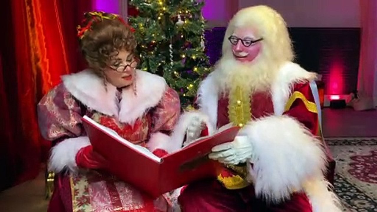 Santa Claus and Mrs Claus are busy going throug...