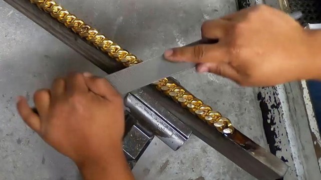 How a goldsmith creates a 14-karat gold Cuban link chain