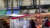 Parisians hit Xmas Eve markets despite COVID woes