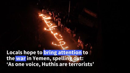Yemenis light candles on Christmas Day in Taez