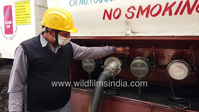Petrol transfer from oil tanker to earth pit storage at HP petrol pump in Delhi