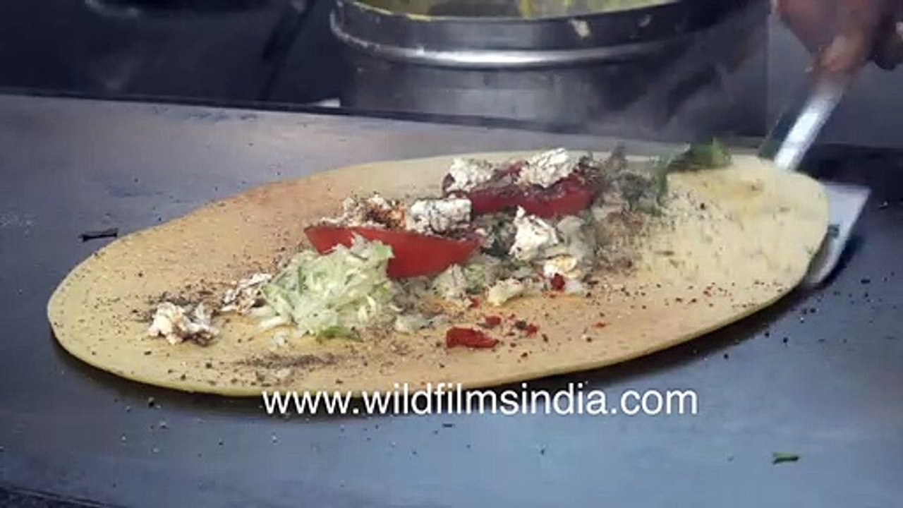 Paneer Chilla or spicy cheese pancake preparati...