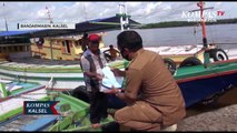 Penegakan Protokol Kesehatan di Pelabuhan Perikanan, Petugas Bagi Masker ke Nelayan dan Warga